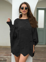Black scalloped knit sweater with boat neck and balloon sleeves