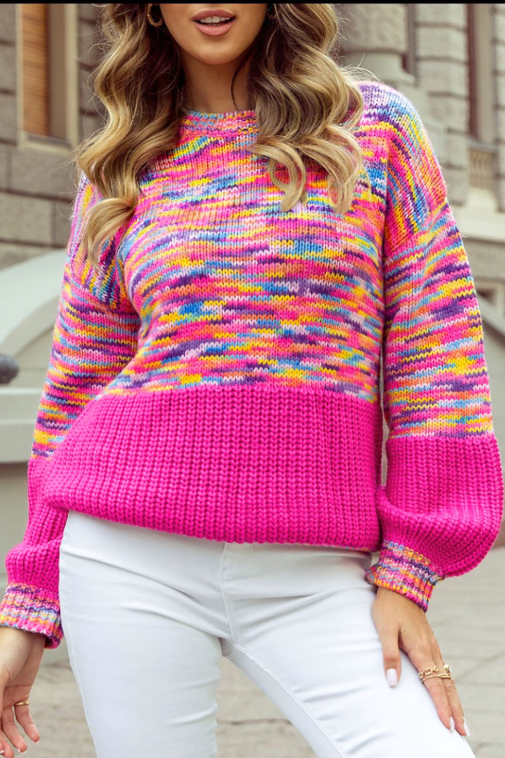 Colorblock marled knit sweater with balloon sleeves and a hot pink ribbed hem.