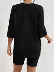 Black ribbed lounge set with relaxed fit top and biker shorts.