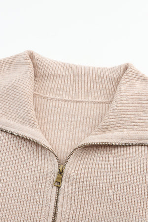 Beige ribbed knit cardigan with shawl collar and zip closure