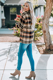 Soft plaid shacket with patch pockets in tan, black, and orange, buttoned front, collared, long sleeves.