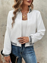 White quilted bomber jacket with striped ribbing on collar, cuffs, and hem.