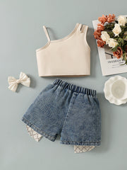 Baby girls' beige asymmetrical tank top and denim shorts set with bow accents.