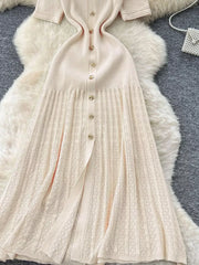Apricot knit dress with Peter Pan collar, button front, and open knit skirt detail.