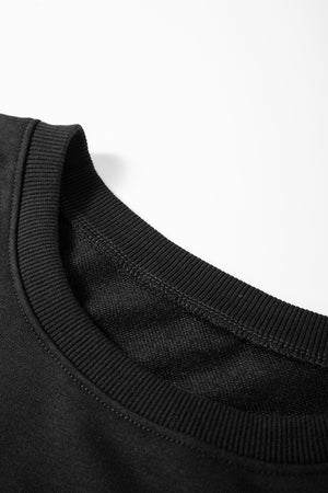 Black blouse with contrast stitching and ribbed crew neck detail