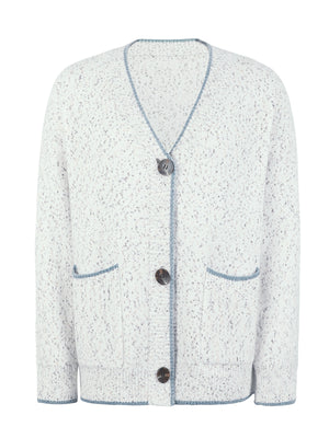 Textured knit cardigan in white with blue contrast trim and buttons.
