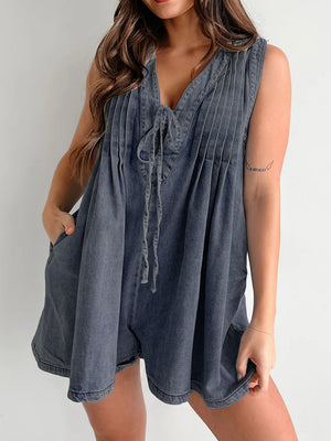Pleated denim tie-front playsuit in dark navy with V-neck and pockets.