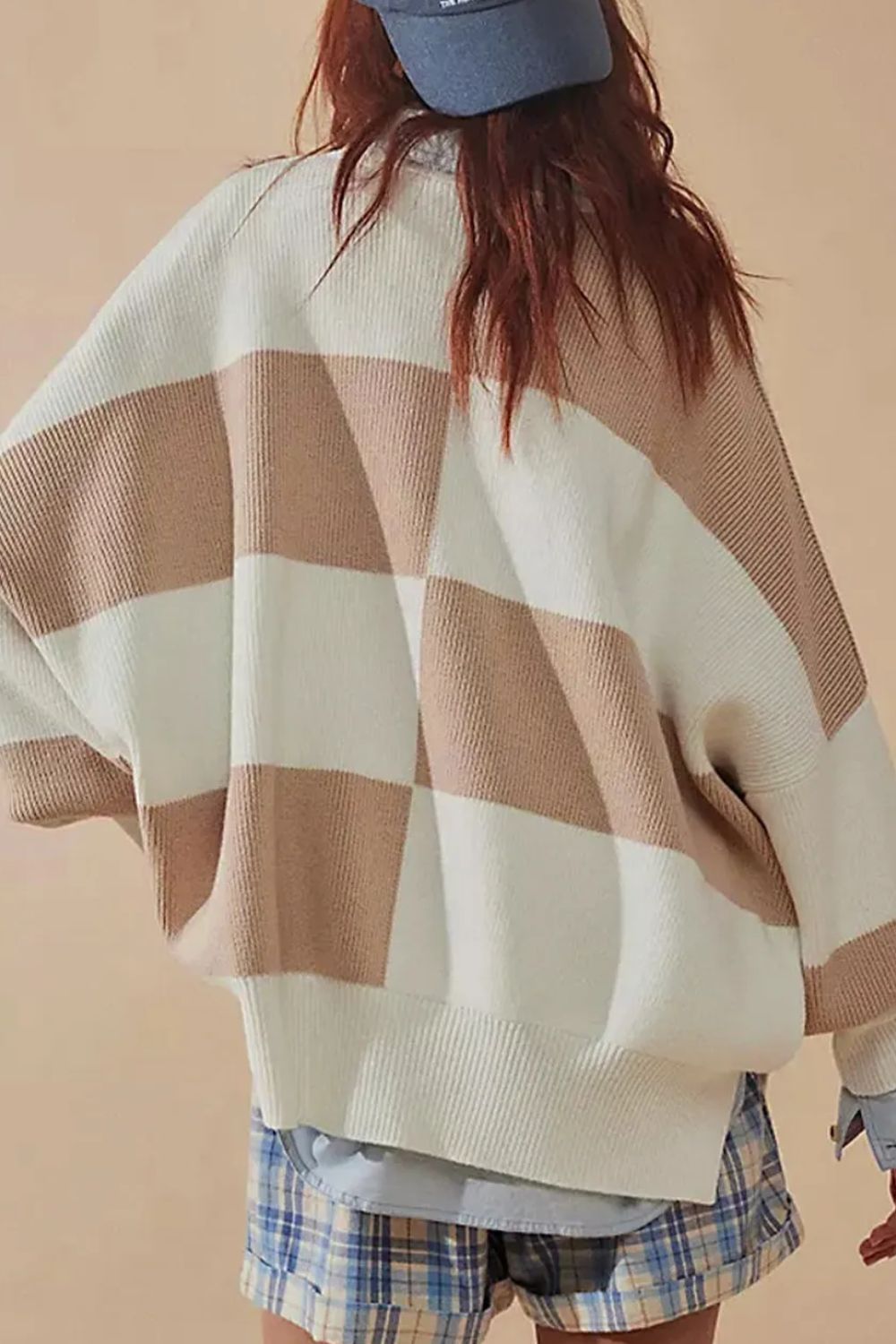 Checkerboard knit oversized sweater in dust storm and cream with crew neck and drop shoulders.
