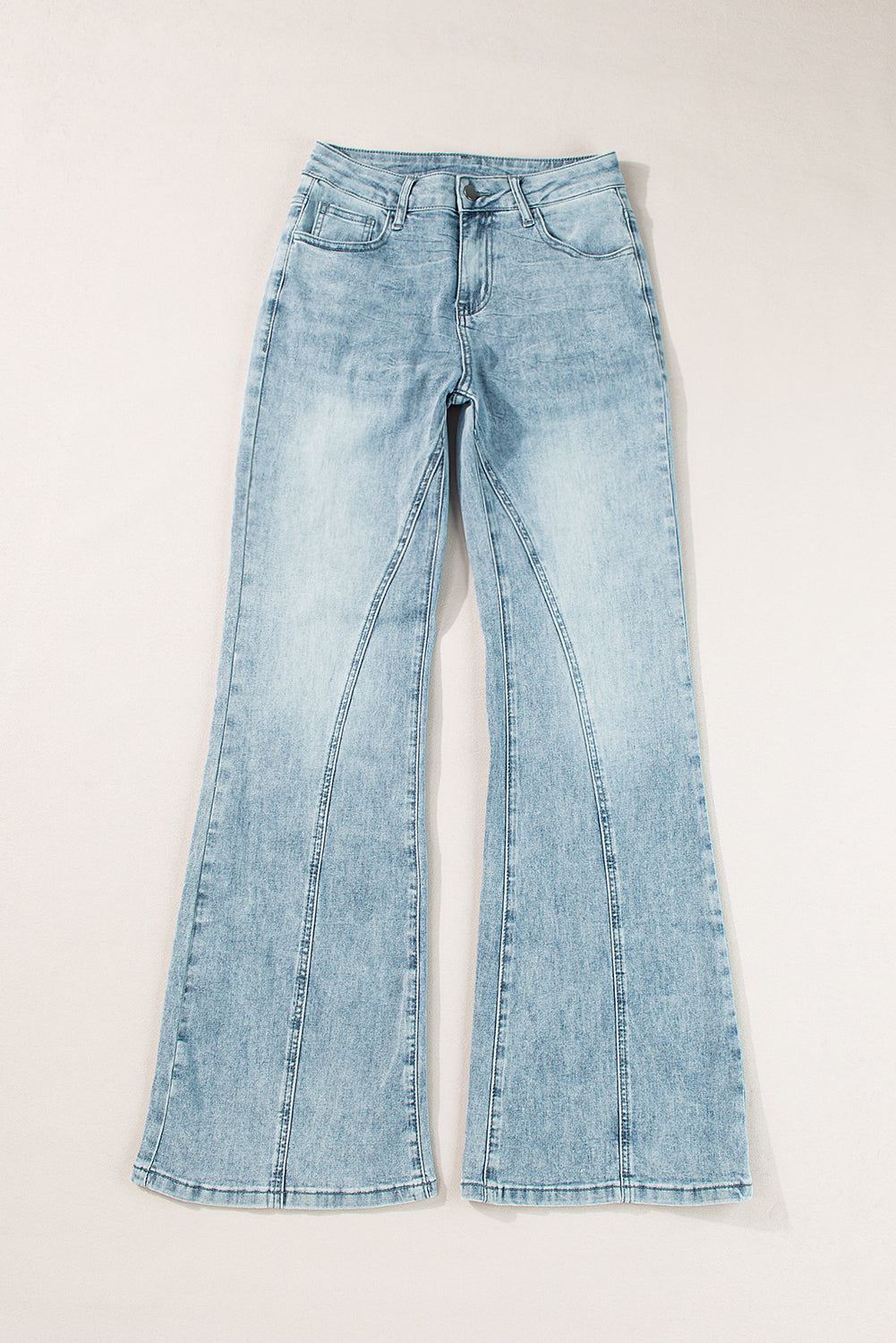 High-waisted palazzo flare denim jeans in medium wash with seam detail.