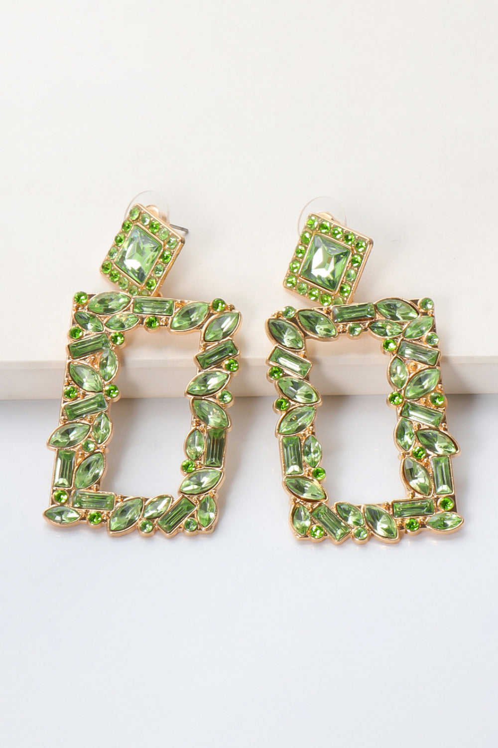 Light Green Geometric Jewel Box Earrings with gold alloy and sparkling stones.