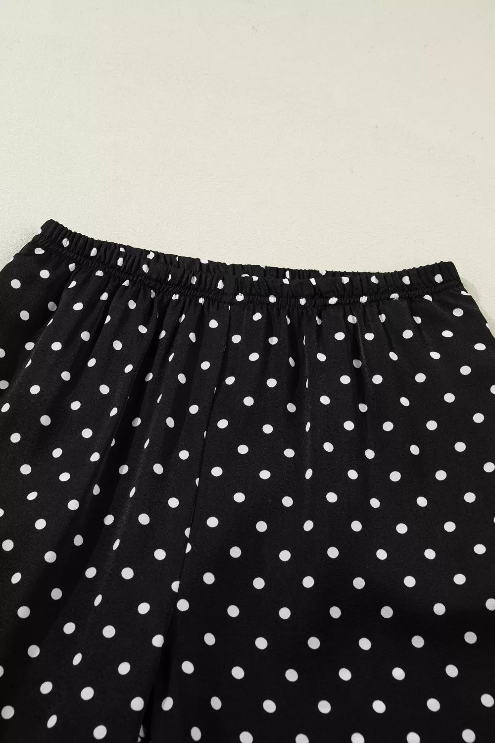 Black polka dot wide-leg maternity trousers with elastic waistband