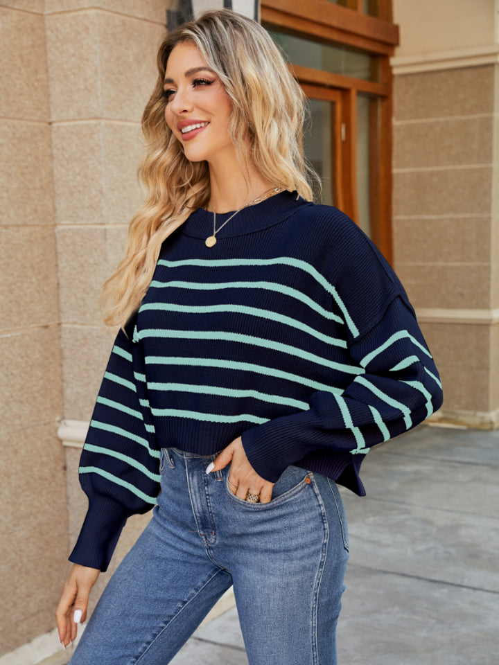 Navy and pastel blue striped cropped knit sweater with balloon sleeves.