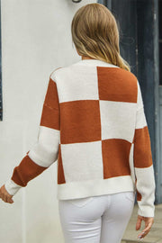 Colorblock geometric knit cardigan in caramel and white acrylic, with a checkerboard pattern.
