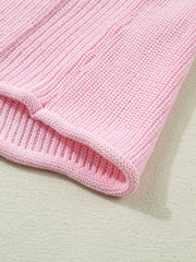 Pink acrylic knit sweater vest with ribbed texture and V-neck detail