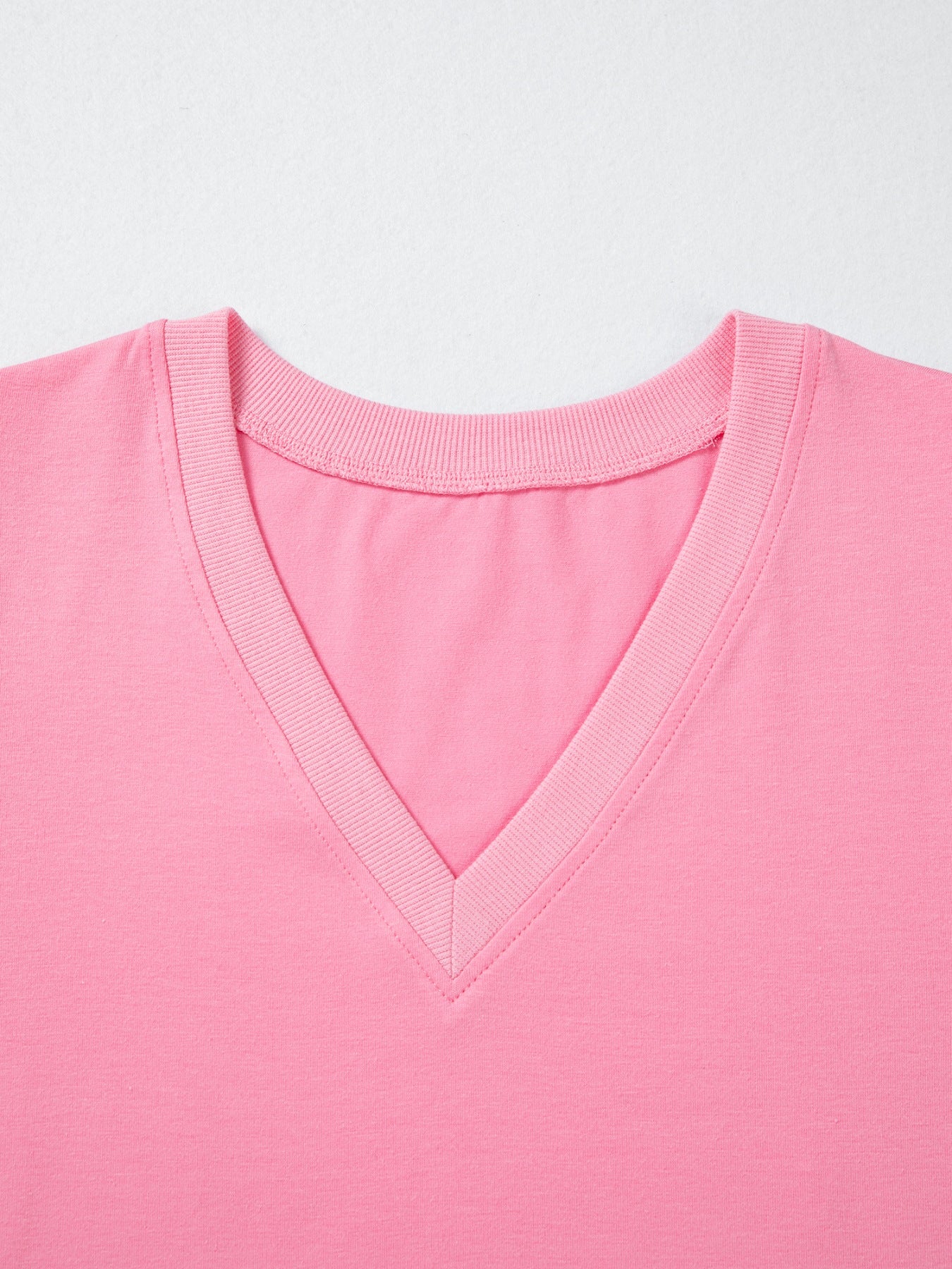 Pink cotton v-neck blouse with ribbed neckline detail