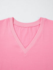 Pink cotton v-neck blouse with ribbed neckline detail
