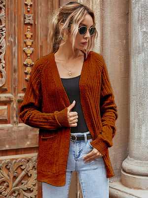 Brown textured knit cardigan with pockets and ribbed cuffs, open front.
