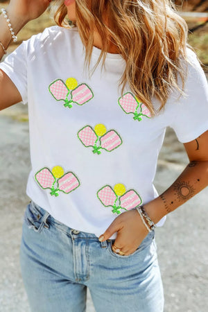 White cotton t-shirt with playful sequin pickleball applique details.