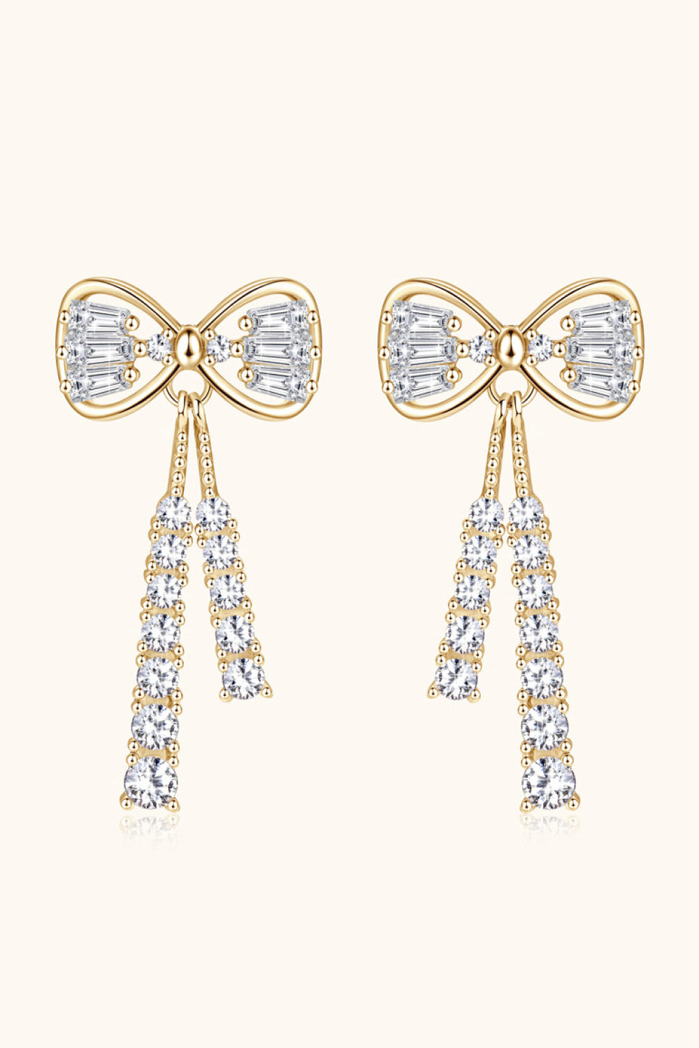 Gold baguette bow drop earrings with crystal tassels