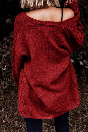 Deep Red open-knit pocket cardigan with cable knit detail on sleeves and sides.