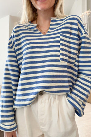 Textured stripe henley top in peacock blue with a chest pocket and notched neckline.