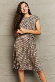 Geometric print midi dress in camel with tie waist and short sleeves.