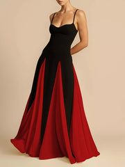 Elegant black and red maxi dress with spaghetti straps and a flowing skirt.