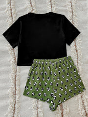 Black short sleeve tee and green panda print shorts pajama set.