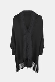 Black faux fur trimmed fringe cape with a V-neck and wide sleeves.