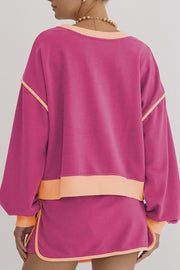 Pink sweatshirt and skort set with contrast trim and crew neck