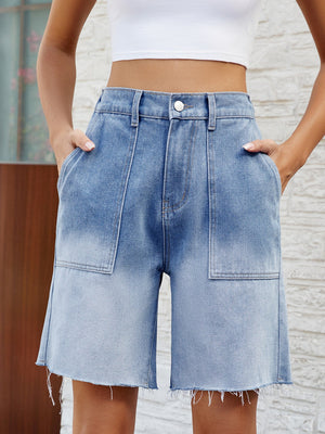 Light blue faded denim carpenter shorts with raw hem and utility pockets.
