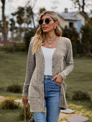 Longline ribbed knit button-down cardigan in beige with pockets and a relaxed fit.