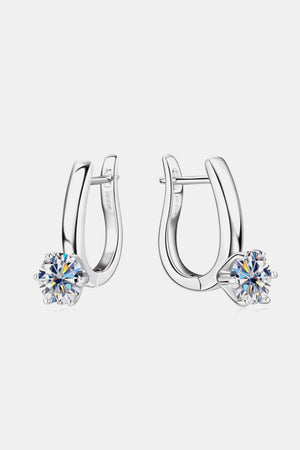 Silver huggie hoop earrings with a single sparkling solitaire gem on each.