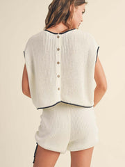 White ribbed knit lounge set with contrast trim and button back detail.