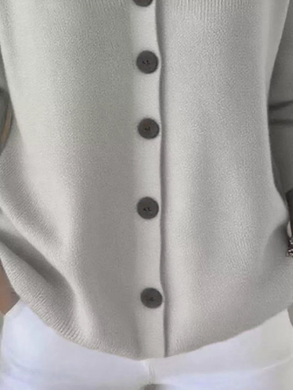 Gray button-front knit cardigan with dark buttons, casual acrylic style.