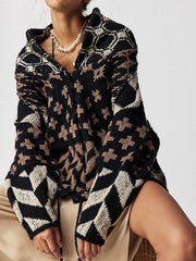 Black knit cardigan with geometric patchwork pattern, featuring a buttoned front and relaxed fit.
