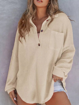 Apricot waffle-knit henley tee with pocket and button detail.