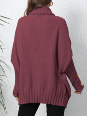 Burgundy turtleneck sweater with button cuff detail and slouchy knit design.