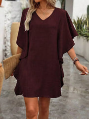Burgundy mini dress with v-neck, ruffled sleeves, and a casual flowy fit.