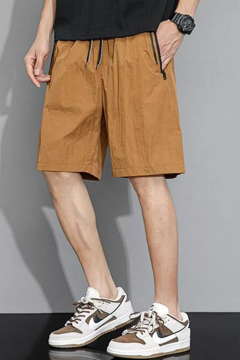 Caramel quick-dry drawstring shorts with zippered pockets and black trim