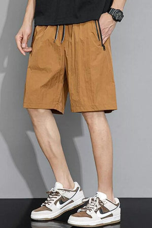 Caramel quick-dry drawstring shorts with zippered pockets and black trim