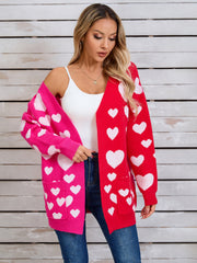 Heartbeat split-panel open cardigan in red and hot pink with white hearts, featuring pockets.