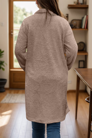 Dust Storm teddy bear texture duster coat with single button closure and pockets.