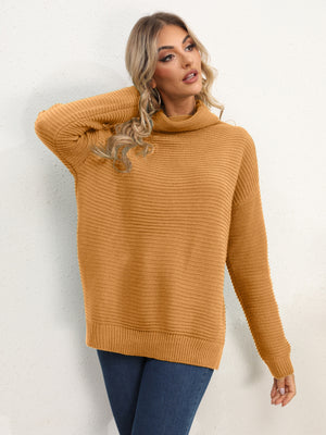 Textured knit oversized turtleneck pullover in mustard acrylic with a ribbed pattern.