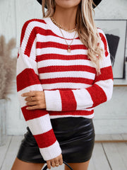 Crewneck sweater in deep red and white bold stripes, knit material, long sleeves.