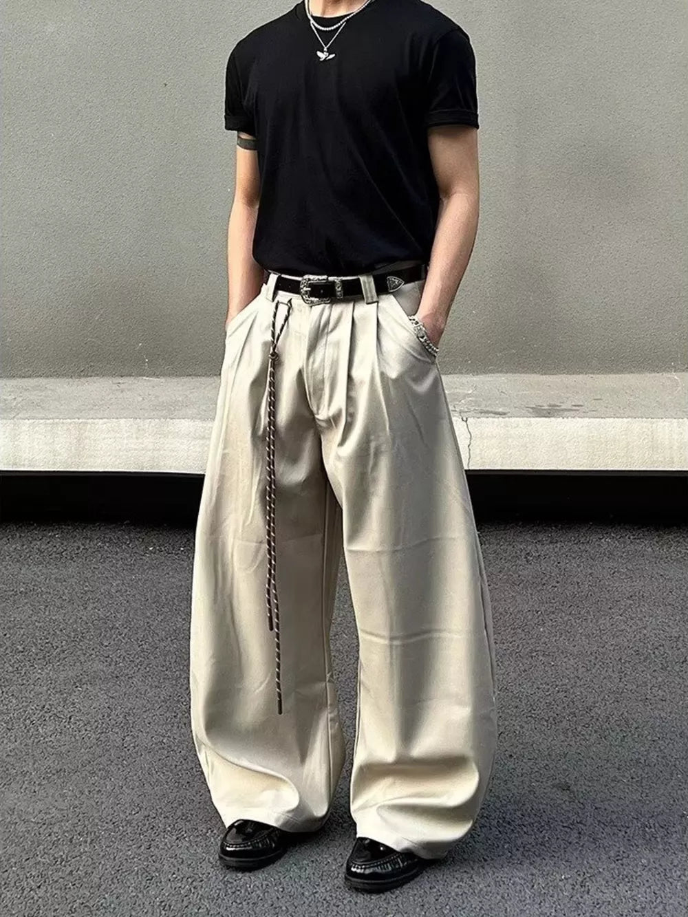 Men's apricot wide leg joggers with a drawstring and pleats.