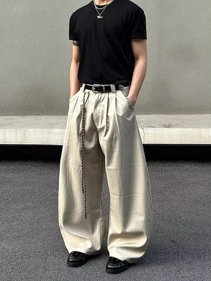 Men's apricot wide leg joggers with a drawstring and pleats.