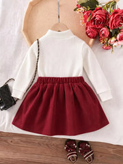 Children's Floral Applique Mock Neck Top And Pleated Skirt Set in White, back view