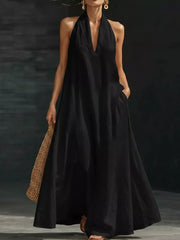 Black halter neck maxi dress with pockets, V-neck, sleeveless, flowing skirt, 100% polyester.