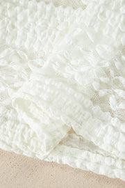 White lace patchwork sheer t-shirt with textured details and a cotton blend fabric.